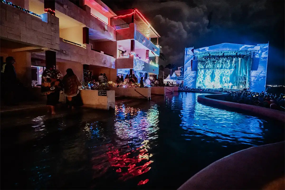 An ocean front suite swim-up pool with the main Beach Stage in the background