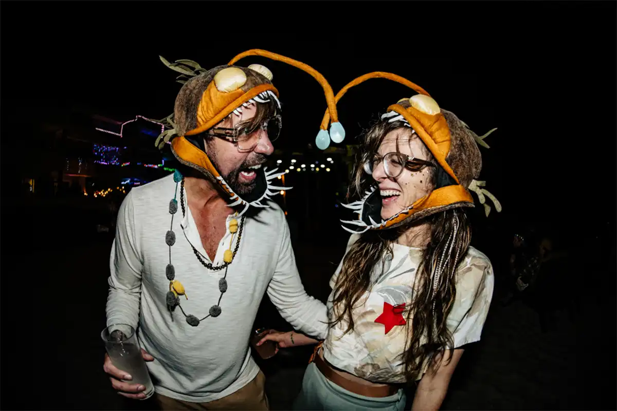 Guests posing in theme night costumes.