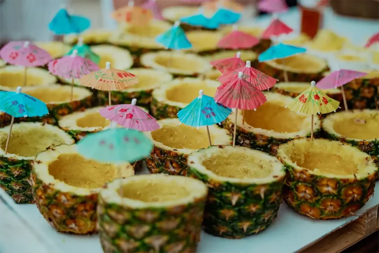 Close up photo of a tray of tropical drinks.