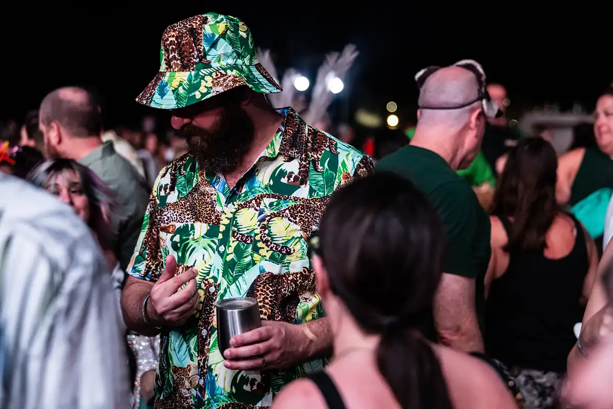 A guest wearing a jungle print theme night outfit.