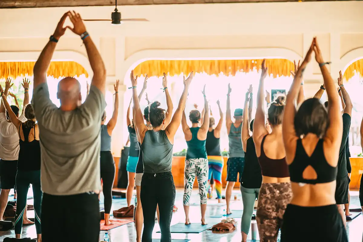 Guests in a yoga pose during morning group yoga.
