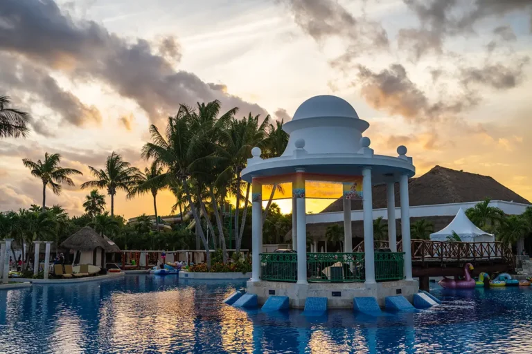 The poolside gazebo stage with a sunset in the background.
