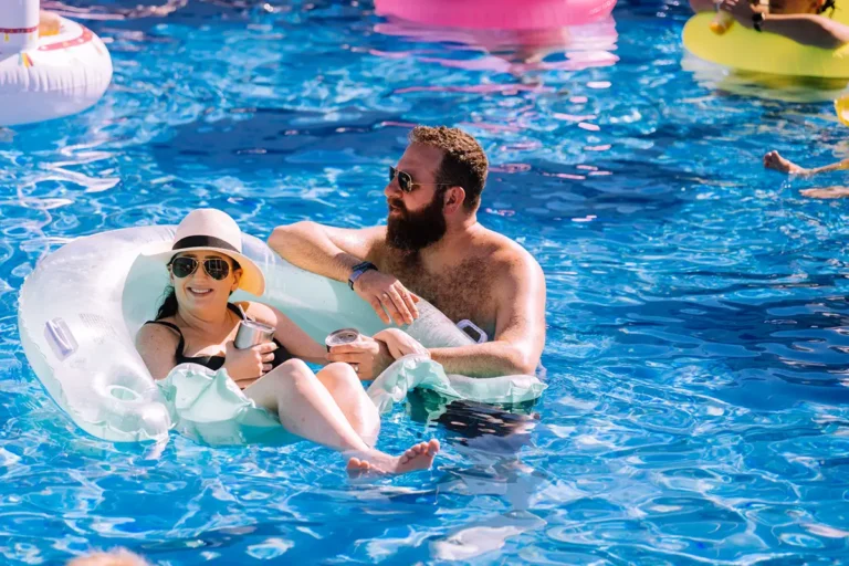 Guests floating in the pool.
